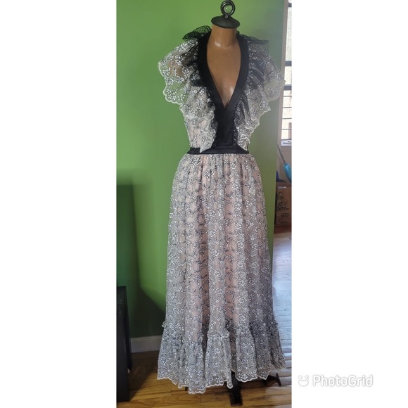 Valentino’s maxi dress is crafted of white, and black scalloped floral lace. - Picture 1 of 7